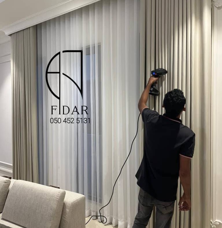 Wave-fold curtains wrapping a corner wall in a modern apartment